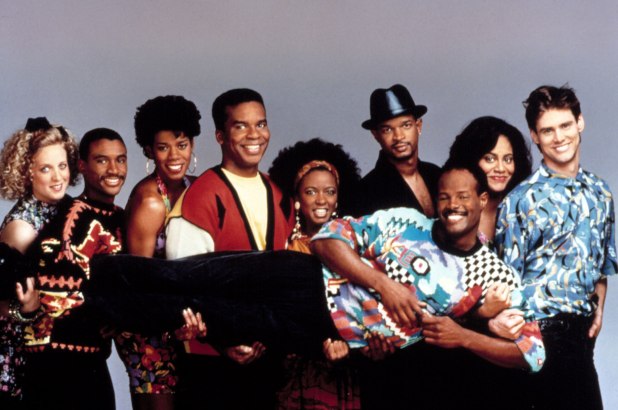 Keenan Ivory Wayans being held up by his cast